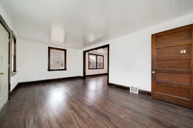 a view of a livingroom with wooden floor