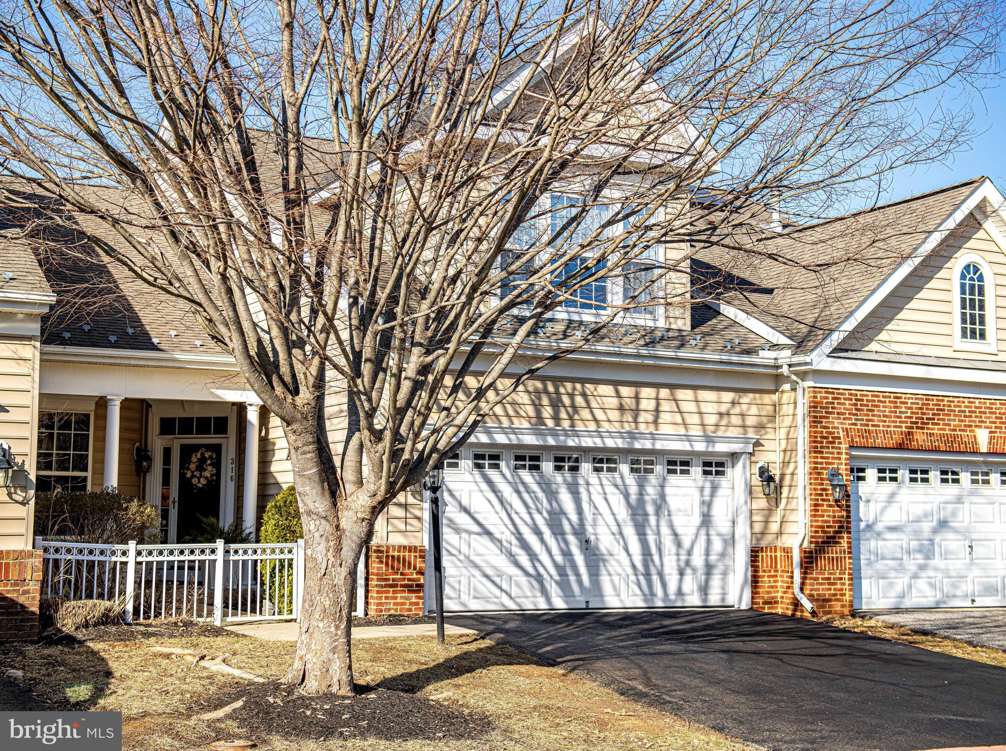 316 Native Dancer Circle Havre de Grace, MD 21078 - Photo 1 of 54 a view of a house with a large tree and wooden fence