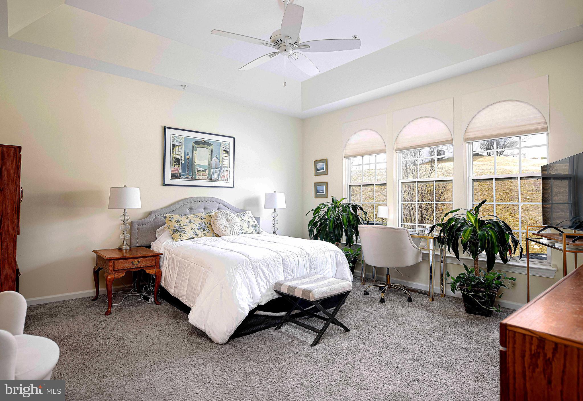 316 Native Dancer Circle Havre de Grace, MD 21078 - Photo 17 of 54 a spacious bedroom with a bed and a chandelier