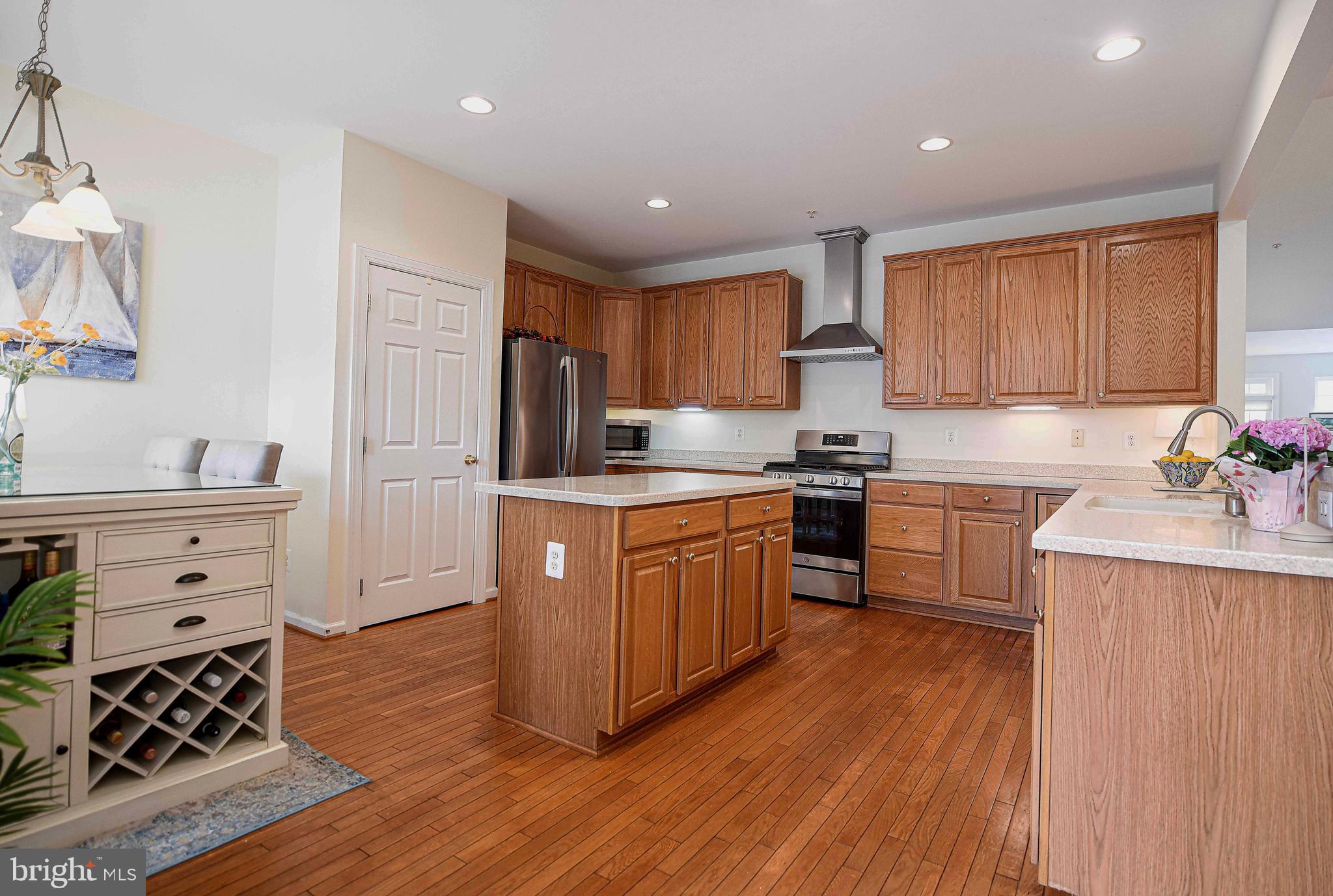 316 Native Dancer Circle Havre de Grace, MD 21078 - Photo 4 of 54 a kitchen with granite countertop a refrigerator stove top oven and sink