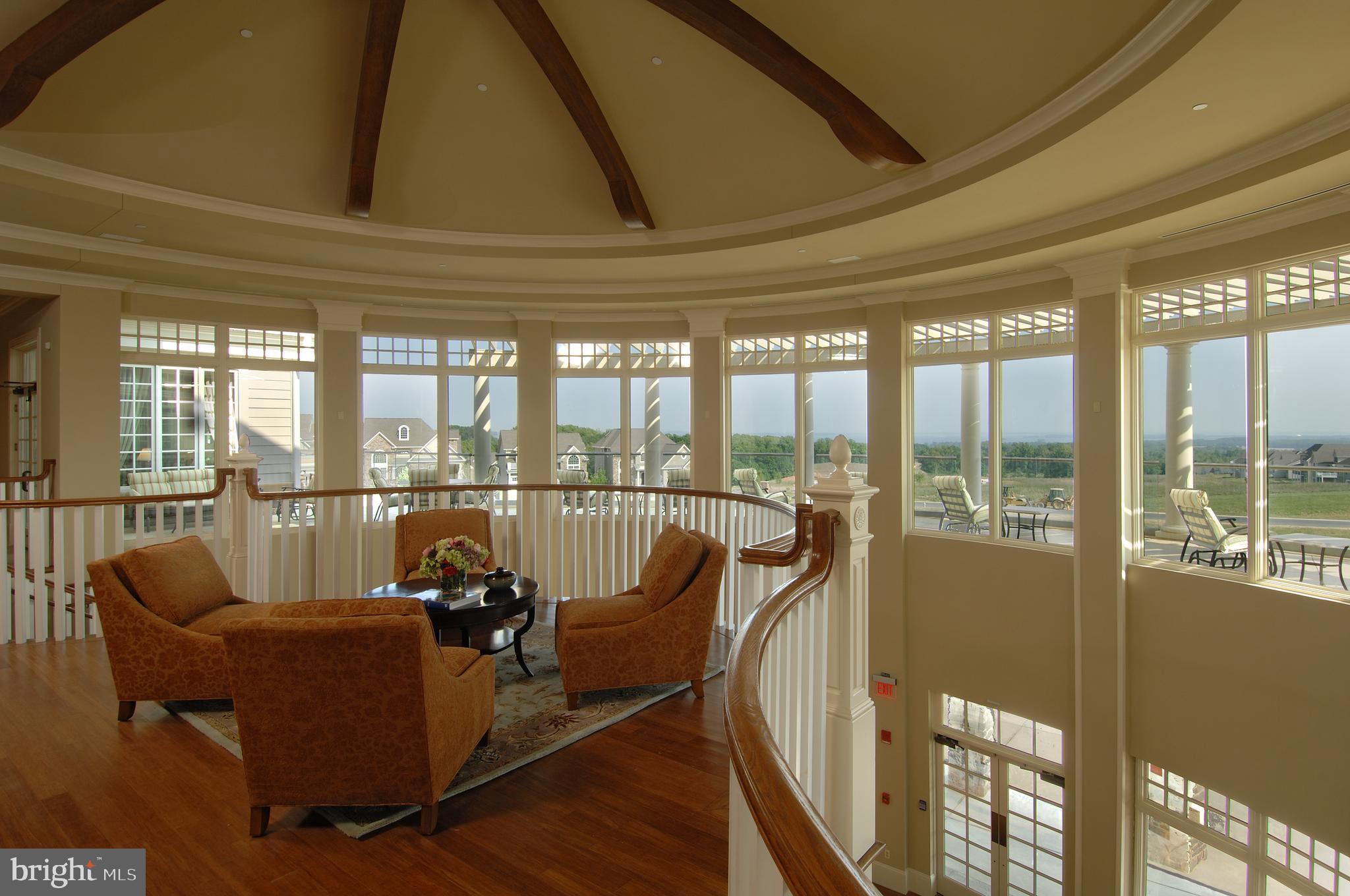 316 Native Dancer Circle Havre de Grace, MD 21078 - Photo 49 of 54 a living room with furniture floor to ceiling windows and city view