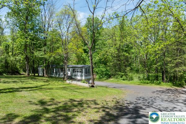 325 Pullen Station Road Quakertown, PA 18951 - Photo 21 of 23 a view of a park with swings and a trees