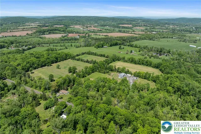 a view of a field with an ocean
