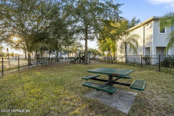 a park bench sitting in the middle of a park