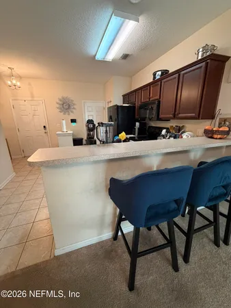 a kitchen with a sink cabinets and counter space