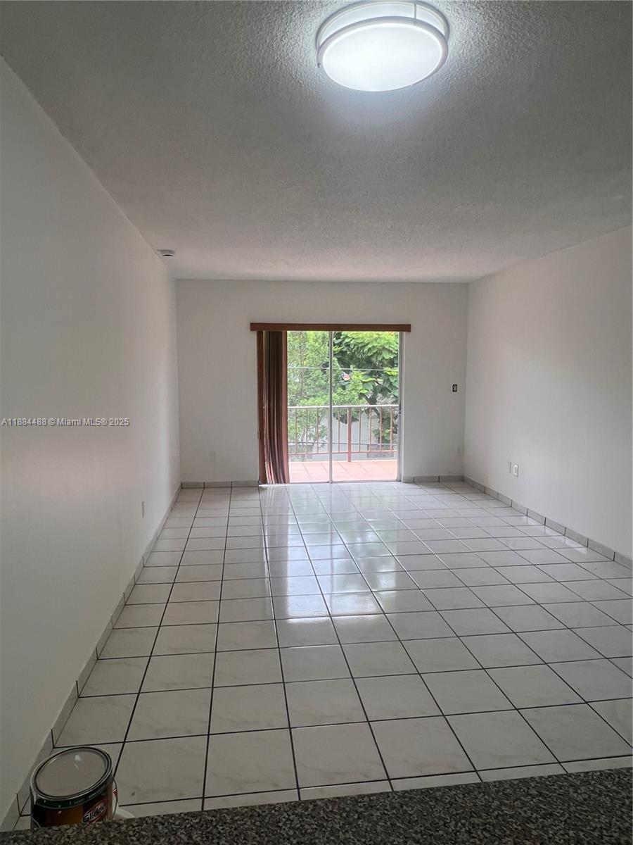 10851 Southwest 2nd Street, Unit K304 Sweetwater, FL 33174 - Photo 11 of 16 a view of an empty room and window