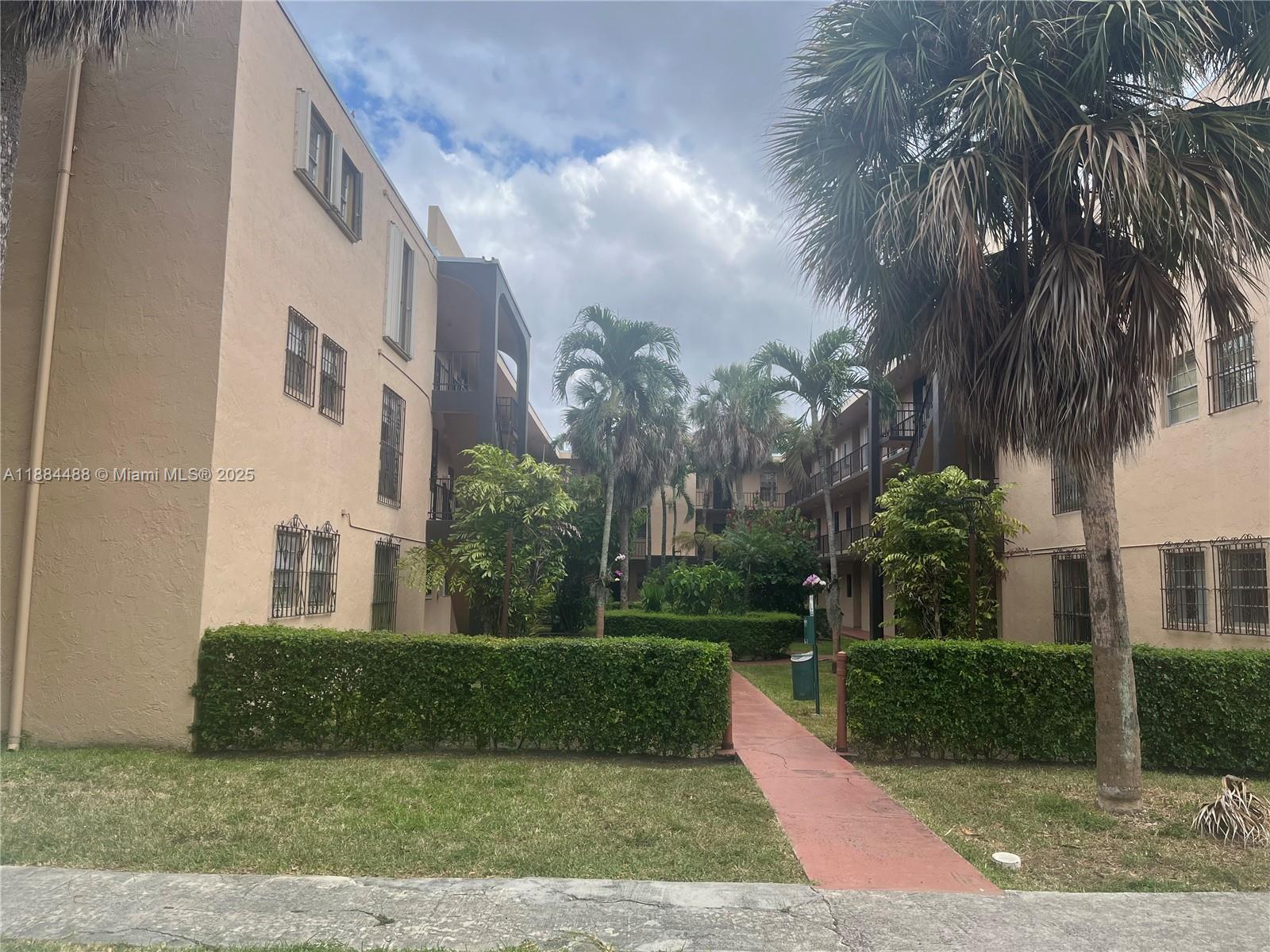 10851 Southwest 2nd Street, Unit K304 Sweetwater, FL 33174 - Photo 15 of 16 a view of a street in front of a building