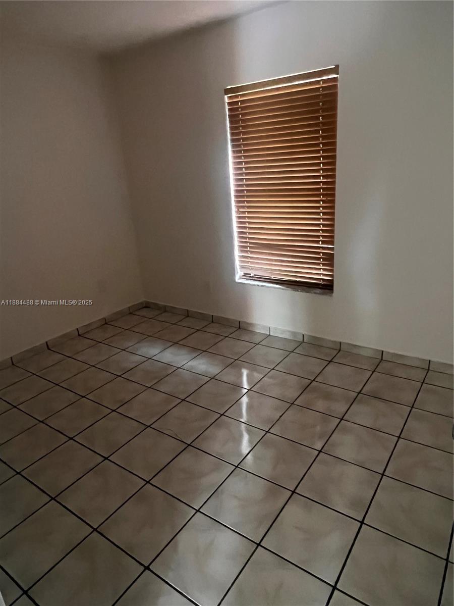 10851 Southwest 2nd Street, Unit K304 Sweetwater, FL 33174 - Photo 4 of 16 a view of a room and window