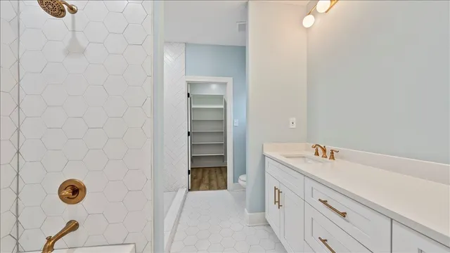 a bathroom with a sink and mirror