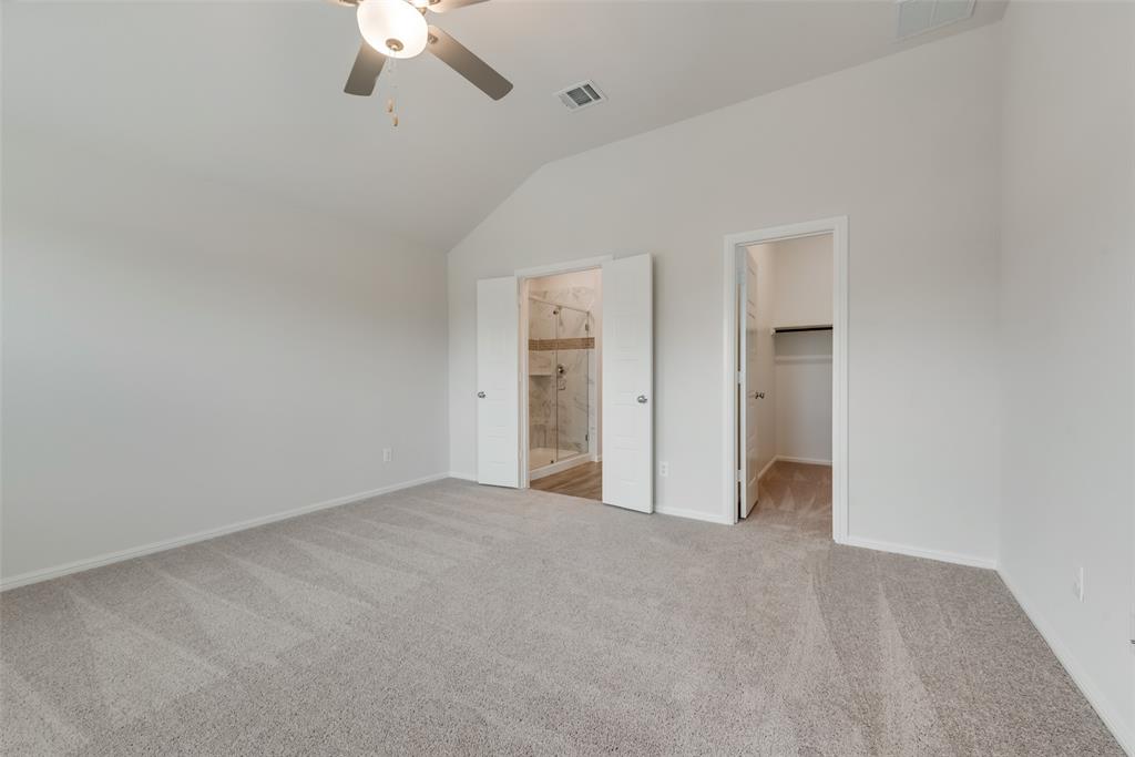 1137 Catalan Trail Mesquite, TX 75149 - Photo 13 of 22 a view of an empty room with a ceiling fan