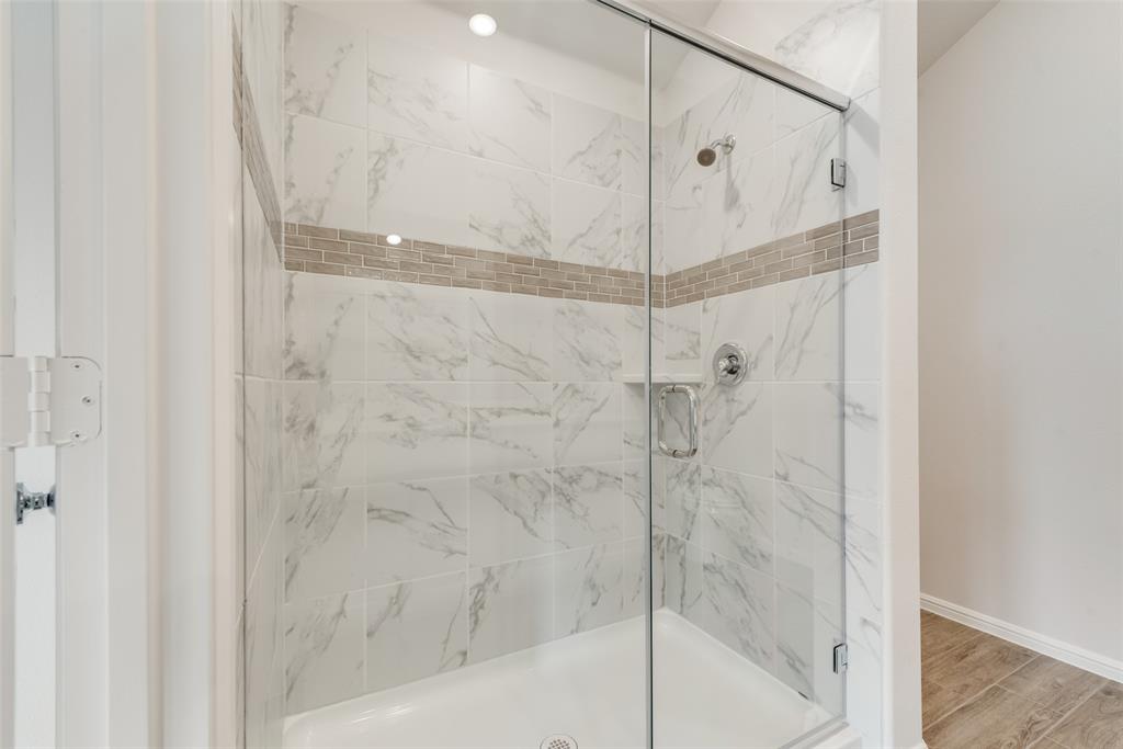 1137 Catalan Trail Mesquite, TX 75149 - Photo 17 of 22 a bathroom with a glass shower door