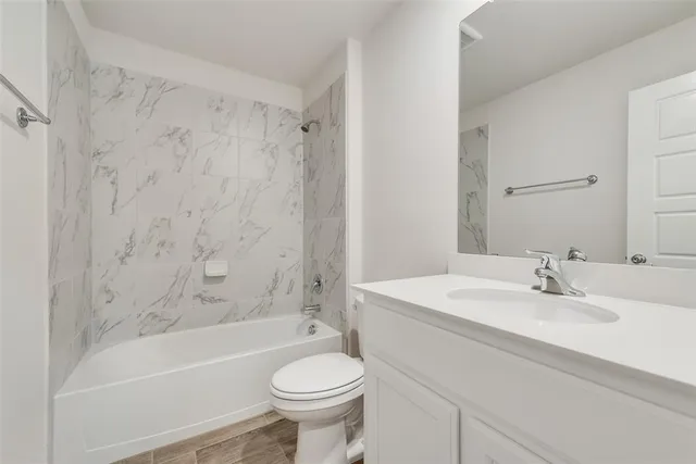 a bathroom with a sink a toilet and a bathtub