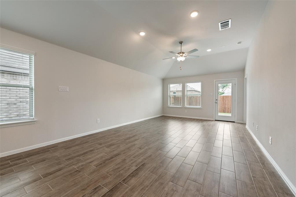 1137 Catalan Trail Mesquite, TX 75149 - Photo 4 of 22 an empty room with wooden floor and windows