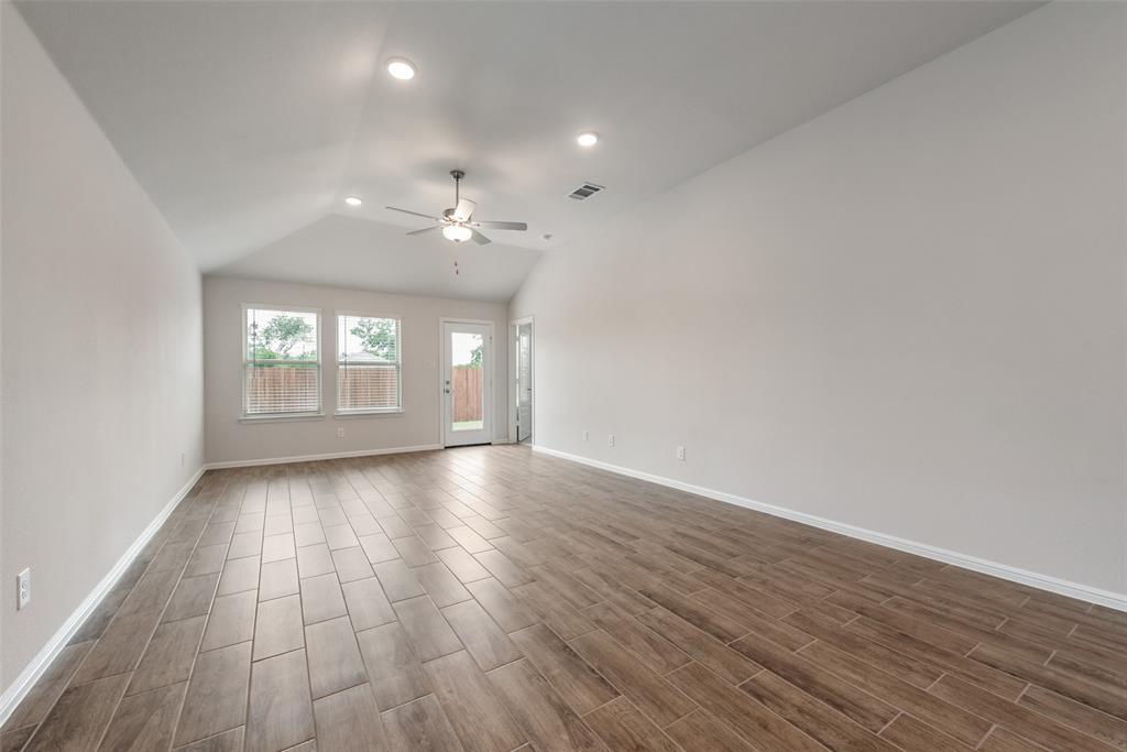 1137 Catalan Trail Mesquite, TX 75149 - Photo 5 of 22 an empty room with wooden floor and windows