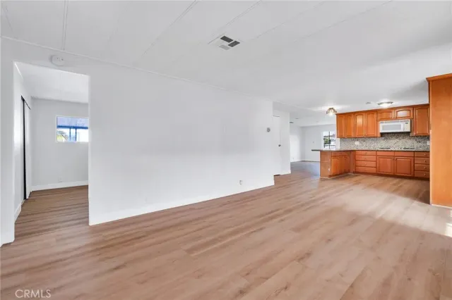 a view of kitchen and wooden floor