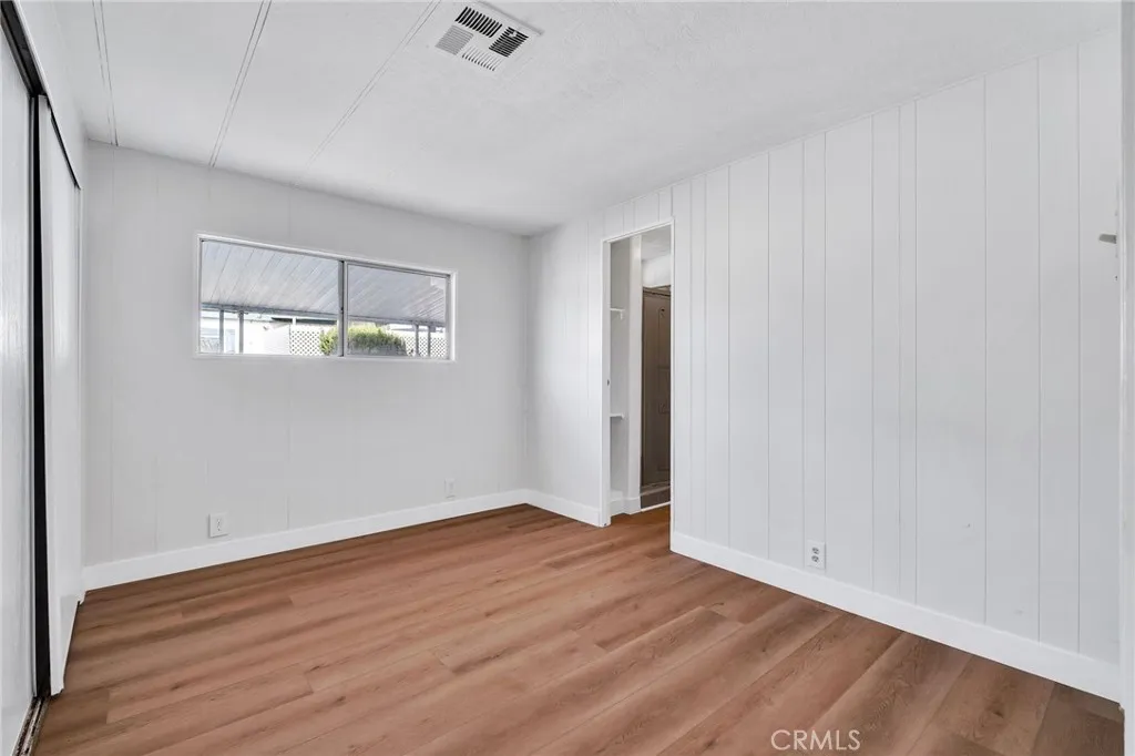 17700 Avalon, Unit 267 Carson, CA 90745 - Photo 29 of 50 an empty room with wooden floor and windows