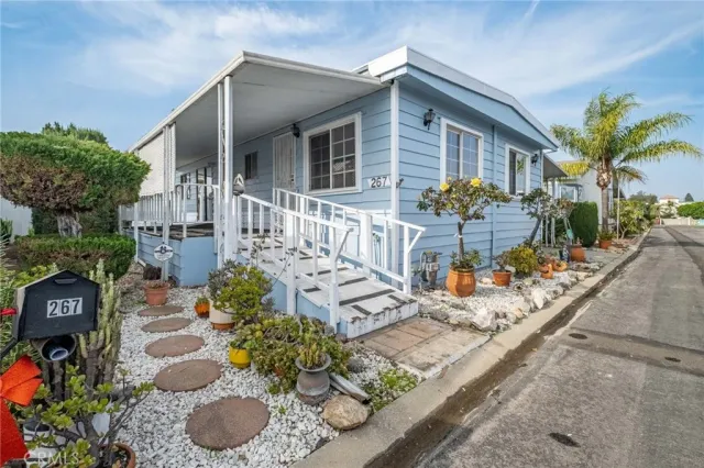 a view of a chairs and table in a backyard