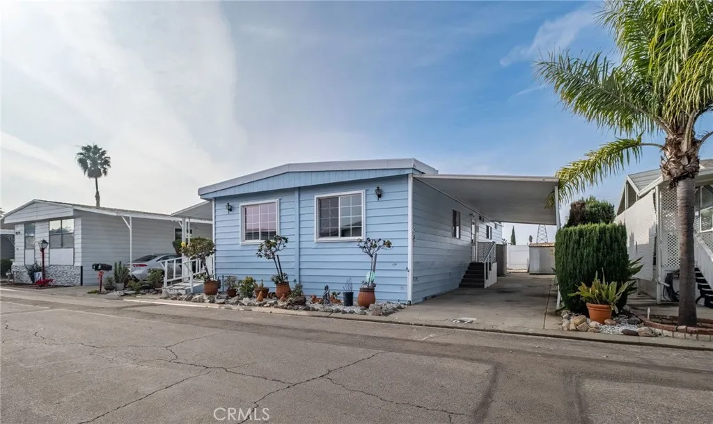 17700 Avalon, Unit 267 Carson, CA 90745 - Photo 48 of 50 a front view of a house with a yard