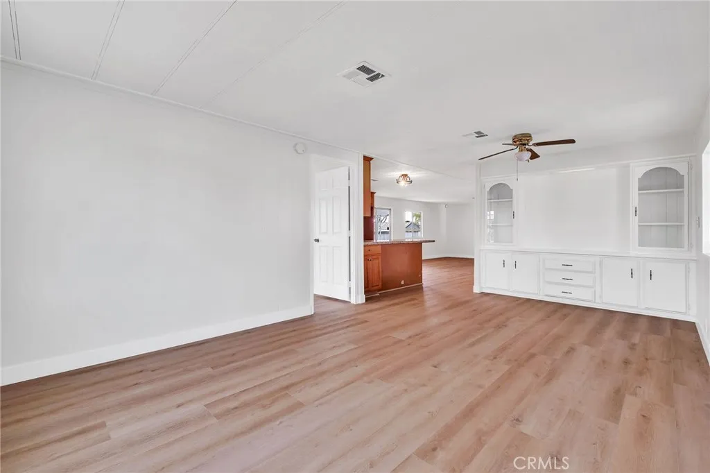 17700 Avalon, Unit 267 Carson, CA 90745 - Photo 8 of 50 a view of a big room with wooden floor and a kitchen