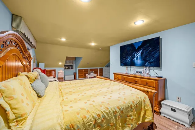 a bed room with a bed and a television