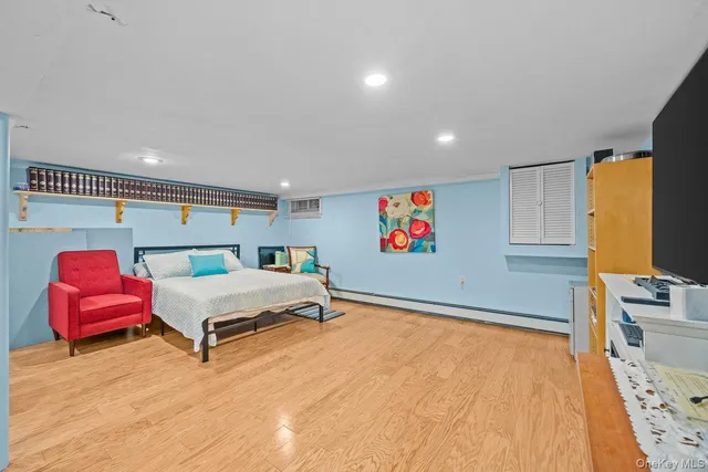 a bedroom with a bed and a dresser in it