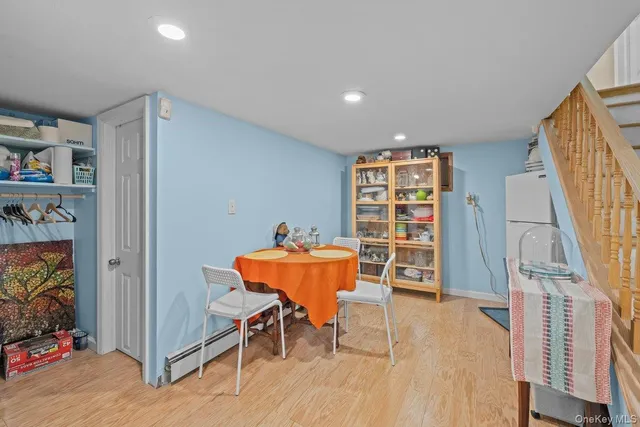 a view of a livingroom with furniture and an empty room