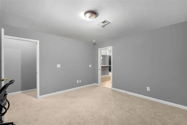 a view of a livingroom with an empty space and a window