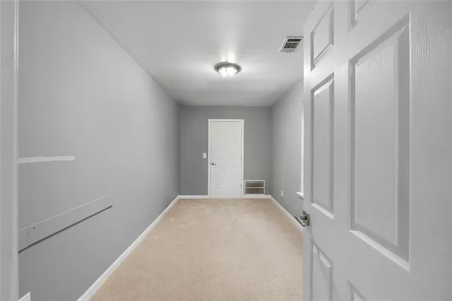 a bathroom with a white toilet and a vanity