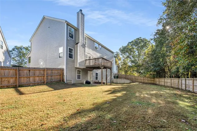 a view of a backyard with trees