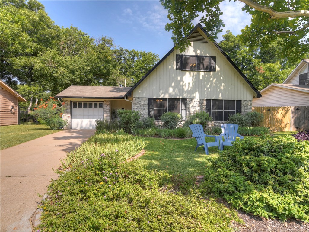 6702 Isabelle Drive Austin, TX 78752 - Photo 1 of 1 a front view of a house with a yard and porch