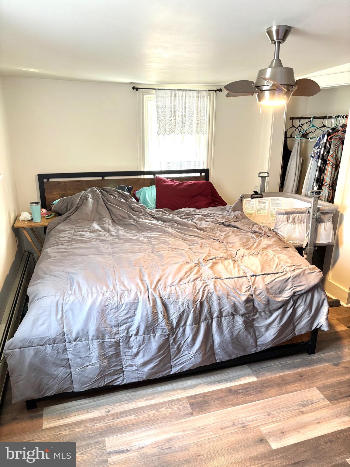 418 Bridge Street Lewistown, PA 17044 - Photo 12 of 23 a bedroom with a bed and wooden floor