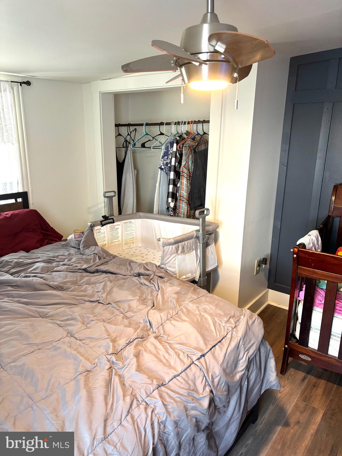 418 Bridge Street Lewistown, PA 17044 - Photo 13 of 23 a bedroom with a bed and ceiling fan