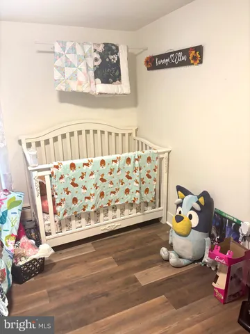 a living room with a flat screen tv and a couch