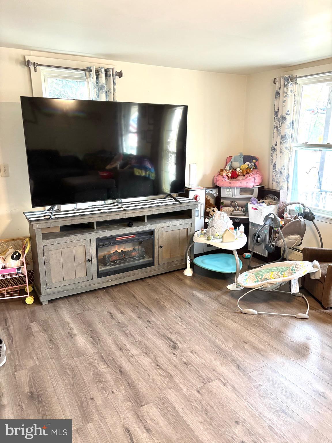 418 Bridge Street Lewistown, PA 17044 - Photo 4 of 23 a living room with furniture and a flat screen tv