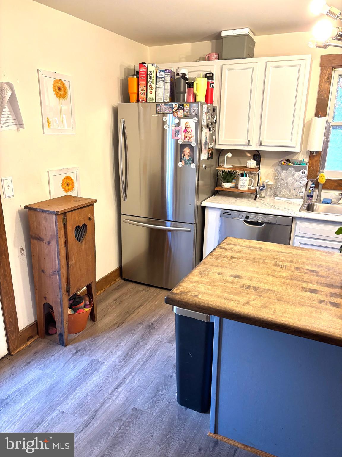 418 Bridge Street Lewistown, PA 17044 - Photo 9 of 23 a kitchen with refrigerator and wooden floor