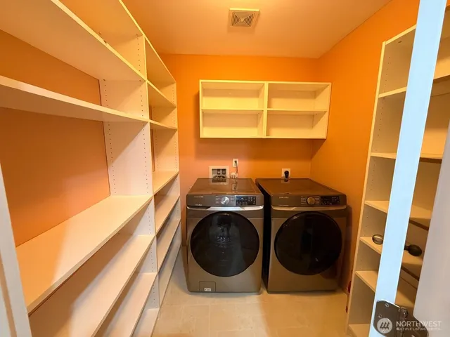 a utility room with dryer and washer