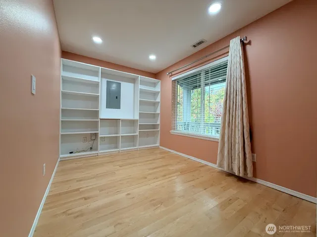 a view of an empty room with a window