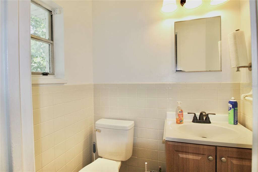 608 Dundee Road Dundee, FL 33838 - Photo 55 of 77 a bathroom with a sink a toilet and mirror