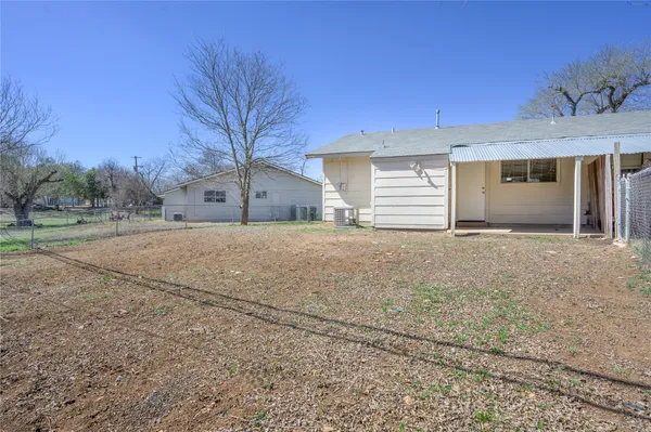 a view of a house with a yard and garage