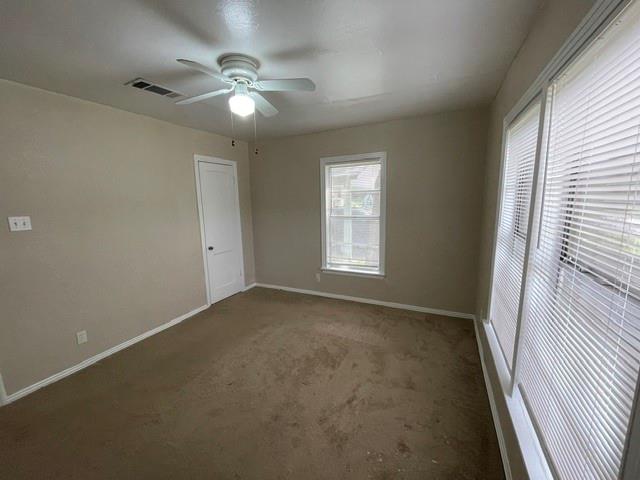 845 Rumfield Road White Settlement, TX 76108 - Photo 10 of 19 an empty room with windows and fan