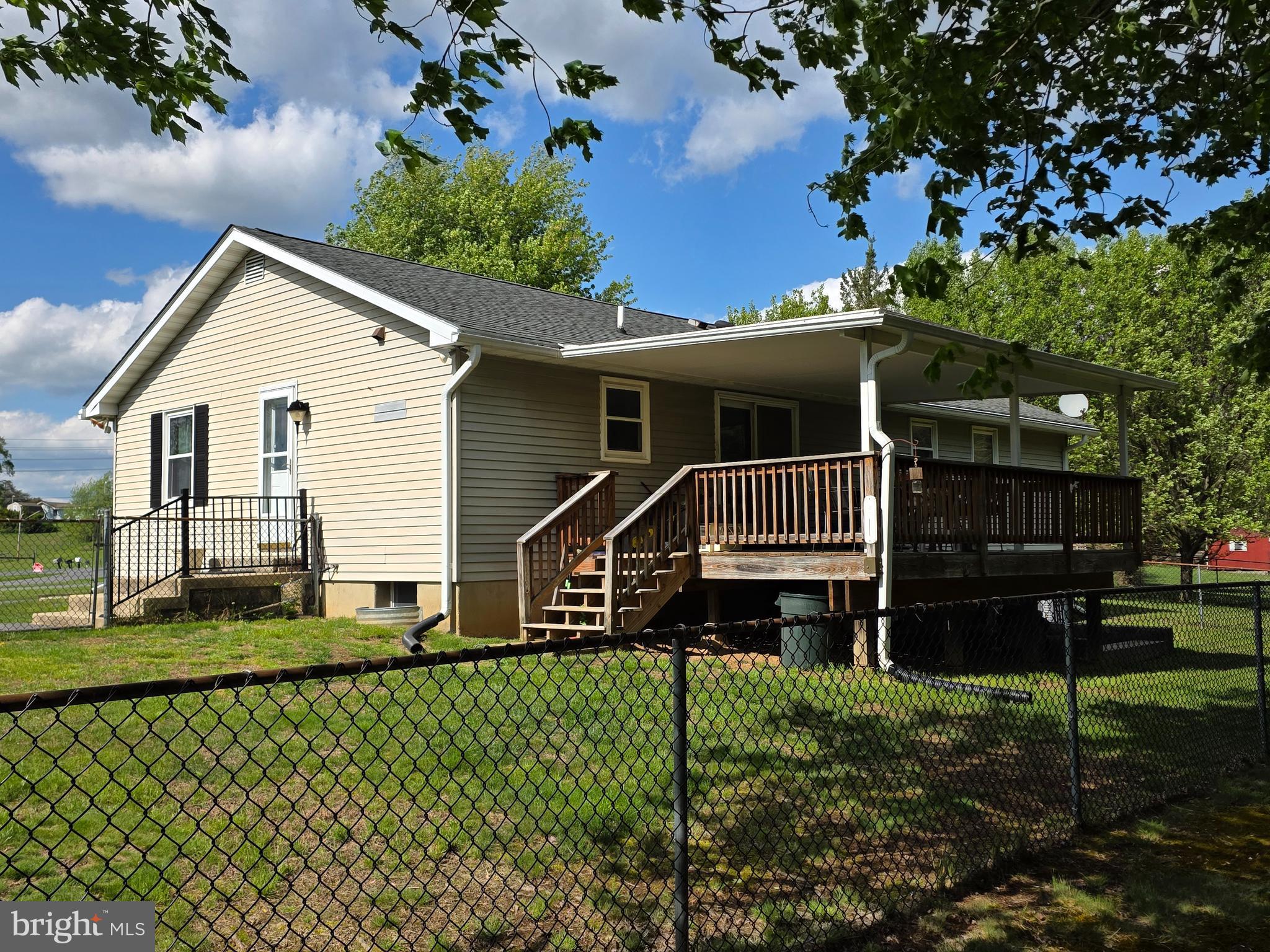5601 Woodville Road Mount Airy, MD 21771 - Photo 2 of 54 a front view of a house with a yard