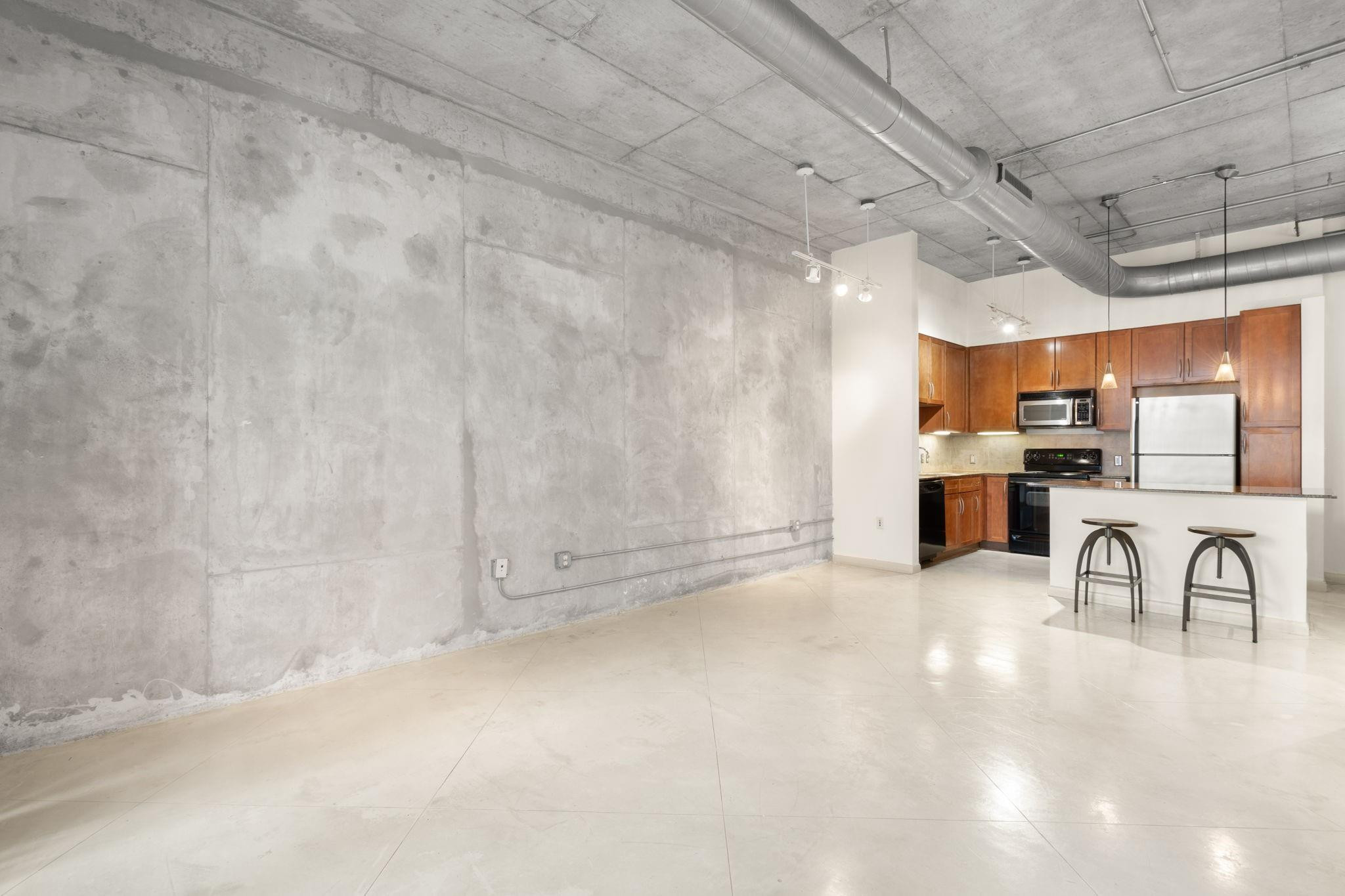 2001 Biscayne Boulevard, Unit 2303 Miami, FL 33137 - Photo 11 of 36 a view of a kitchen with furniture and a kitchen