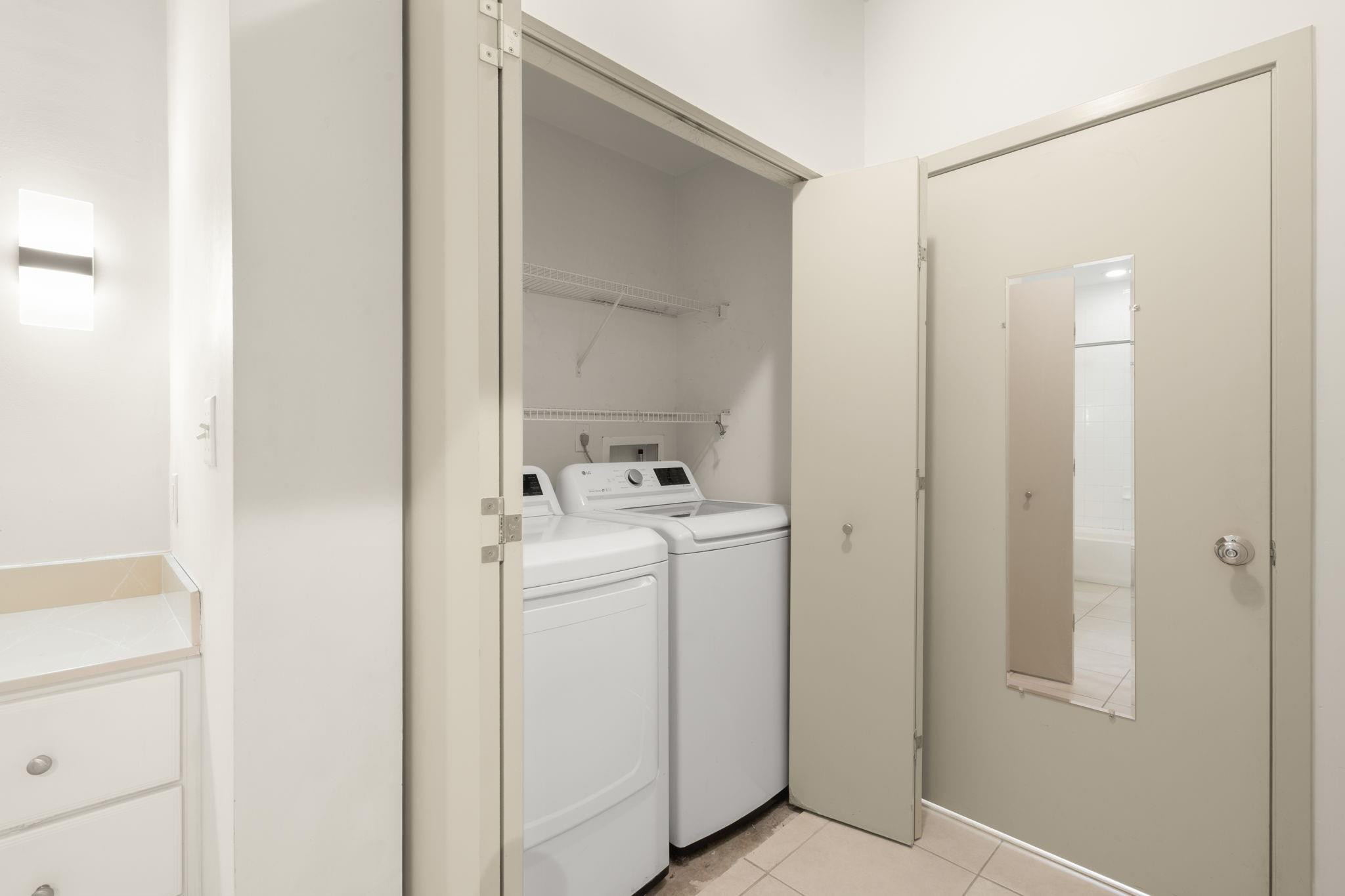 2001 Biscayne Boulevard, Unit 2303 Miami, FL 33137 - Photo 15 of 36 a utility room with dryer and washer