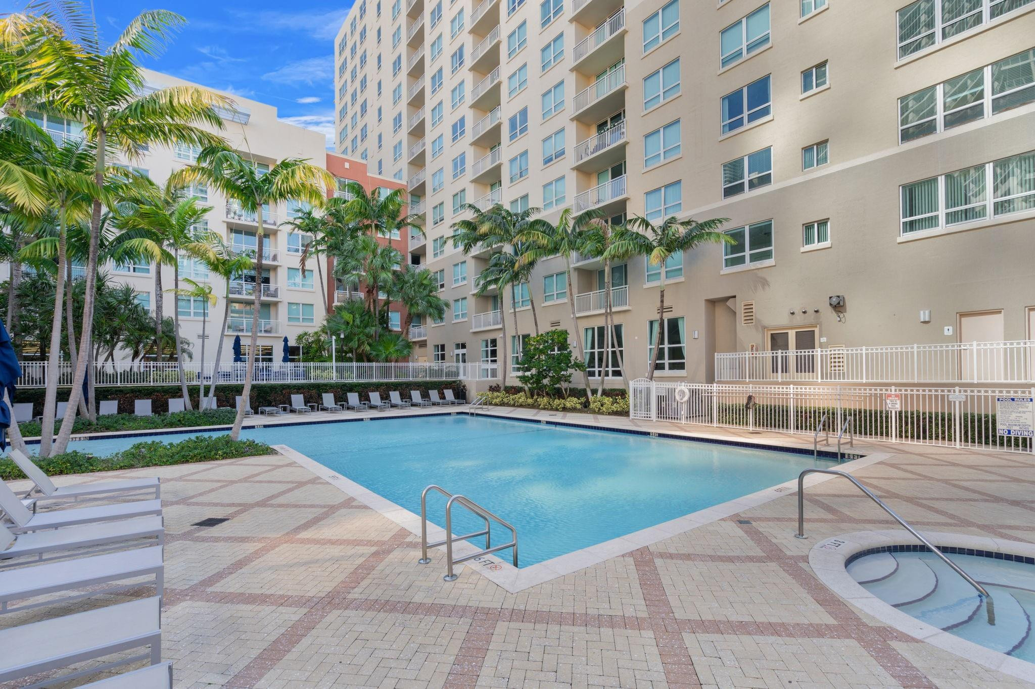 2001 Biscayne Boulevard, Unit 2303 Miami, FL 33137 - Photo 32 of 36 a swimming pool with outdoor seating and yard