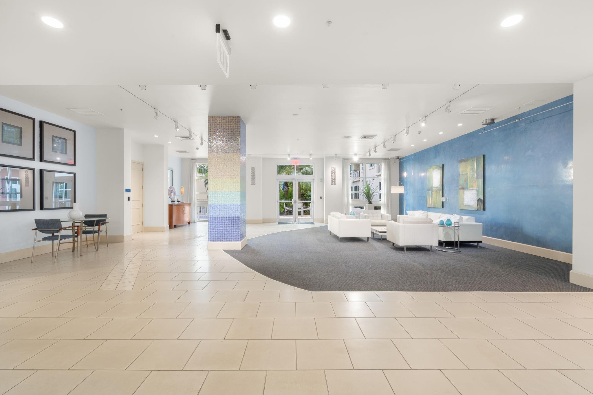 2001 Biscayne Boulevard, Unit 2303 Miami, FL 33137 - Photo 4 of 36 a lobby with furniture and a large mirror