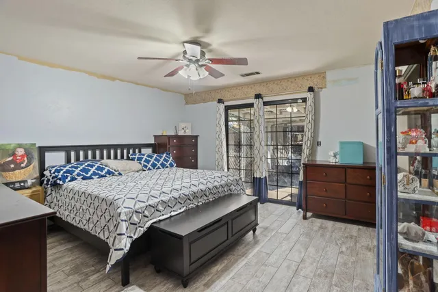 a bed room with a bed and a book shelf