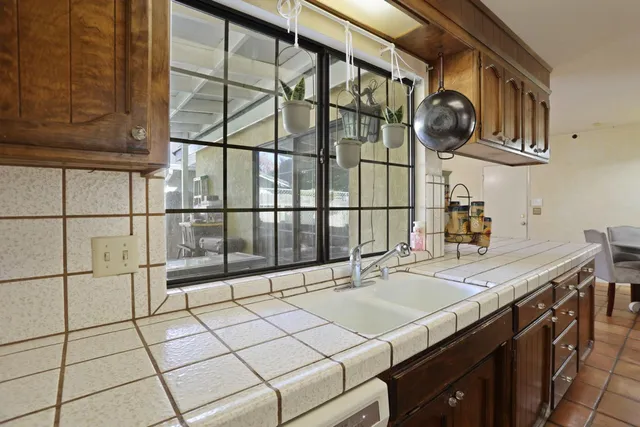a kitchen with a sink and cabinets