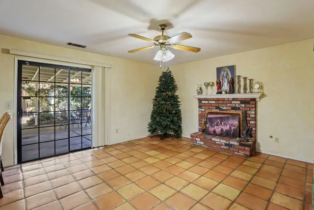 a bedroom with a bed and a fireplace