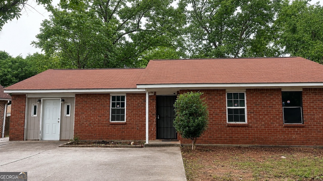 a house with trees in the background