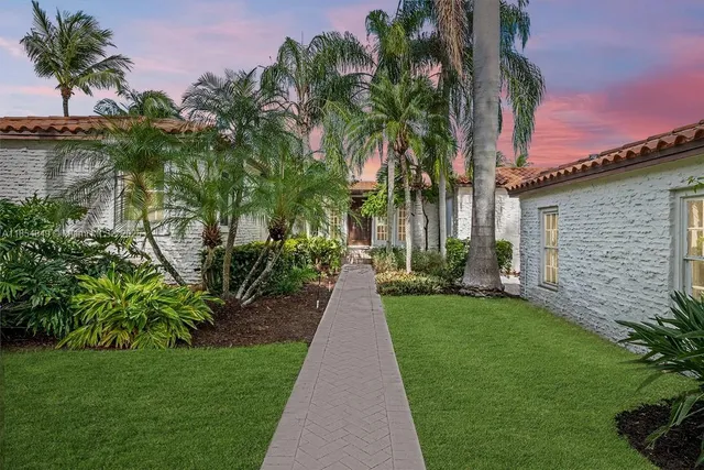 a view of a backyard with potted plants
